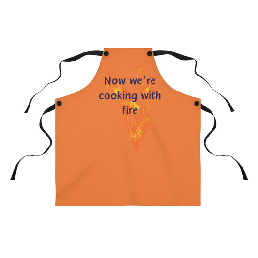 "Now We're Cooking With Fire" (blue on light orange) Apron CF13blo